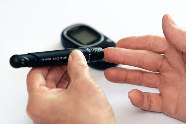 How is a Continuous Glucose Monitor (CGM) device inserted?